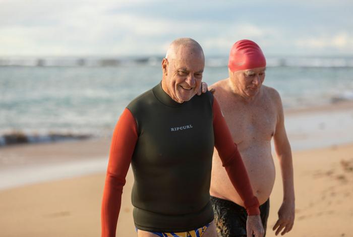 Photo of two seniors on the beach