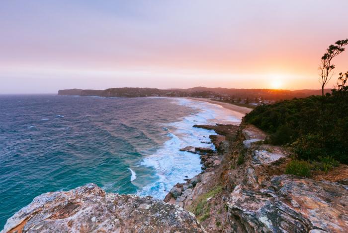 Sunset over Avoca Beach and headland