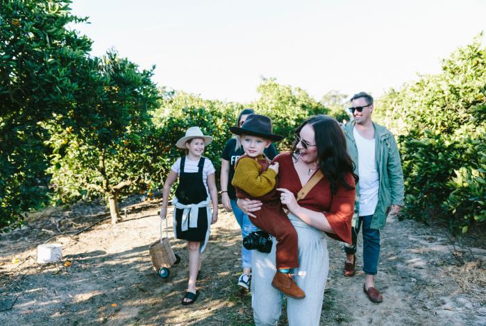 family walking together through a farm