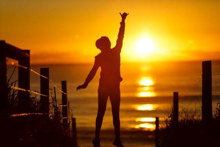 Photo of a person at Wamberal Beach during sunrise